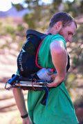 Back view of runner wearing UltrAspire Big Bronco Race Vest