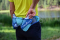 Back on-model view of UltrAspire Speedgoat 3.0 waist pack in lagoon/navy